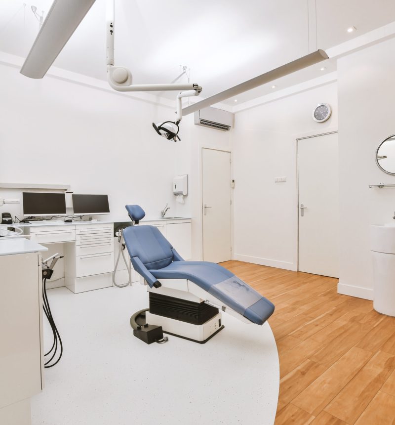 Modern furniture and professional equipment located in light office of contemporary dental clinic